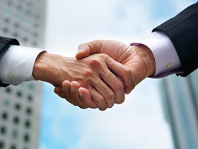 Close-up of hand by which businessman shakes hands